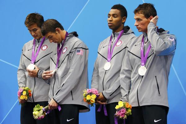 Nathan Adrian, Michael Phelps, Cullen Jones and Ryan Lochte of the U.S. stand with their silver medals in the men's 4x100m freestyle relay victory ceremony during the London 2012 Olympic Games at the Aquatics Centre second place